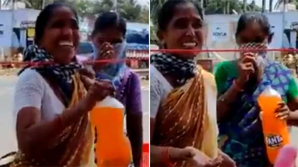 Viral Video shows that a poor woman serves cool drinks for policemen in Andhra Viral Video shows that a poor woman serves cool drinks for policemen in Andhra