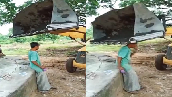 A JCB driver hits a man with its front bucket in Telangana Mulugu FIR booked A JCB driver hits a man with its front bucket in Telangana Mulugu FIR booked