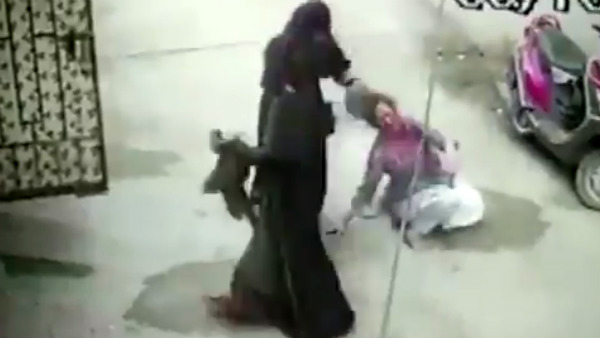 A woman being thrashed by her daughter-in-law and her mother in Hyderabad A woman being thrashed by her daughter-in-law and her mother in Hyderabad