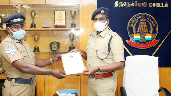 head Constable Jagadeesh sweeping Gravel scattered on road near Panakudi in Nellai head Constable Jagadeesh sweeping Gravel scattered on road near Panakudi in Nellai