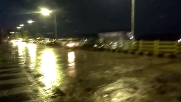 Velachery residents park their cars on the flyover to protect themselves from the rain and floodwaters Velachery residents park their cars on the flyover to protect themselves from the rain and floodwaters