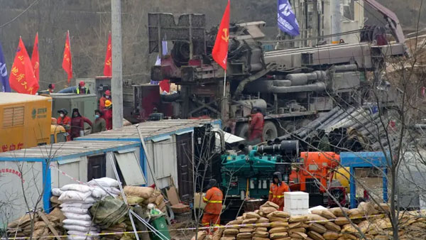 China rescues four miners after 14 days trapped underground China rescues four miners after 14 days trapped underground