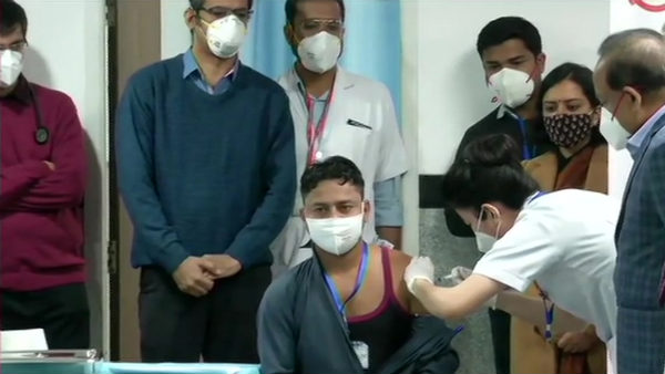 Sanitation worker becomes first person to receive COVID-19 vaccine at AIMS Sanitation worker becomes first person to receive COVID-19 vaccine at AIMS