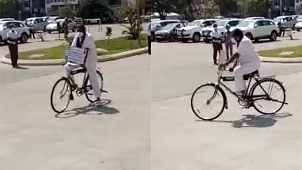 Thamimun Ansari comes by bicycle to the assembly Thamimun Ansari comes by bicycle to the assembly