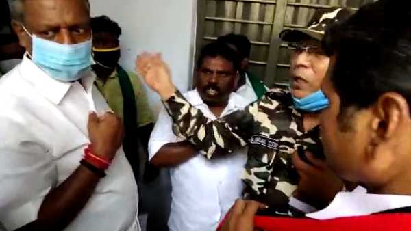 AIADMK man threatening the voters visiting polling stations in Karur AIADMK man threatening the voters visiting polling stations in Karur
