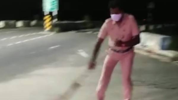 Scattered pebbles on the road; Good deeds done by the police to prevent the accident Scattered pebbles on the road; Good deeds done by the police to prevent the accident