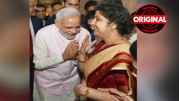 Fact Check: Former Prasar Bharti CEO shares morphed image of PM Modi bowing before Nita Ambani Fact Check: Former Prasar Bharti CEO shares morphed image of PM Modi bowing before Nita Ambani