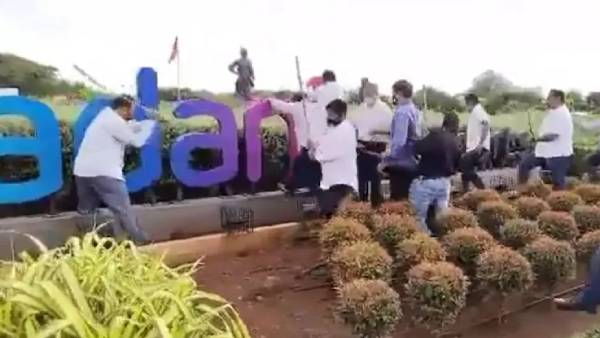 Shiv Sena workers vandalize, remove Adani Airport board in Mumbai Shiv Sena workers vandalize, remove Adani Airport board in Mumbai