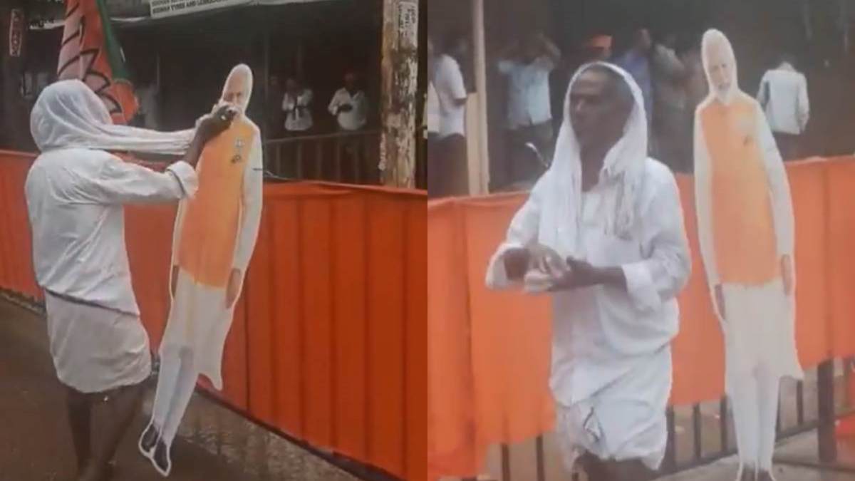 மழையில் நனைந்த பிரதமர் மோடியின் கட்அவுட்! கலங்கிய முதியவரின் ‛அன்பு’ இதுதான்!பெங்களூரில் நெகிழ்ச்சி 