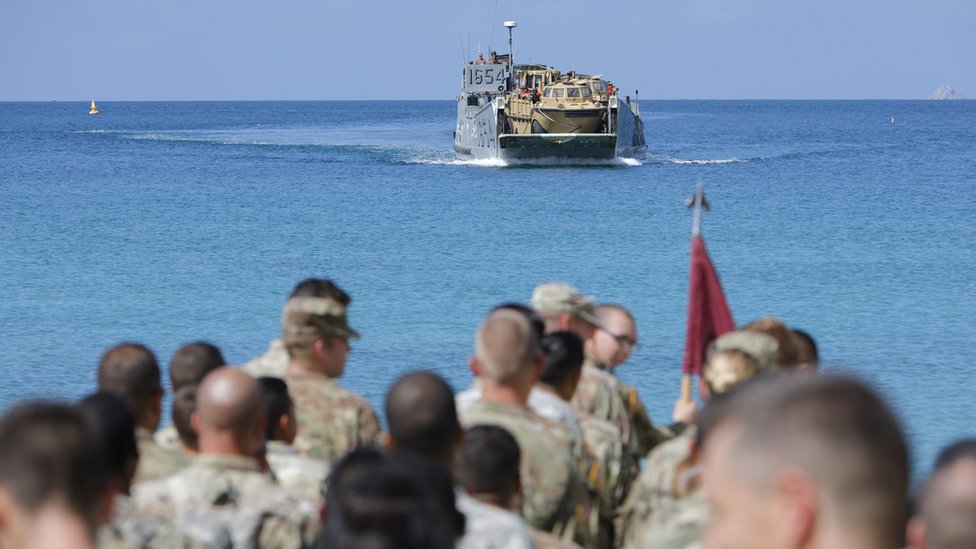 Image shows US soldiers waiting to be evacuated on a beach in the US Virgin Islands on 17 September 2017