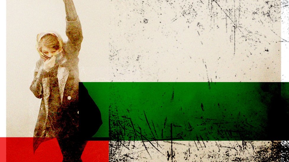 Woman with first in the air